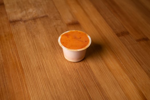 Special Hot Dip chilli sauce served in cup isolated on wooden table top view of indian food photo