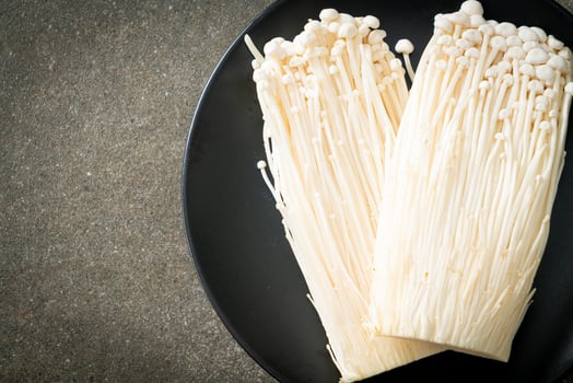 fresh enoki mushroom or golden needle mushrooms photo