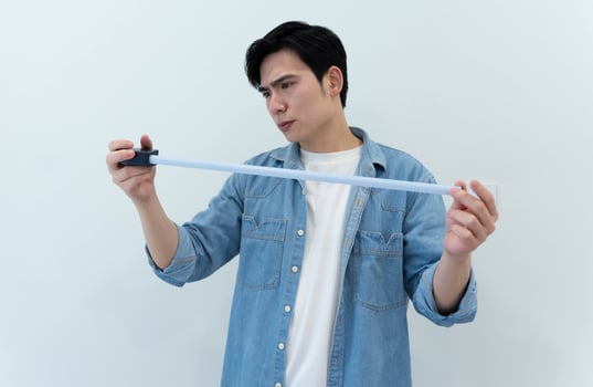 Asian man measuring and repairing houses photo