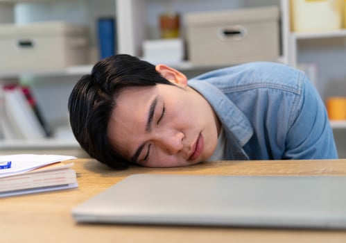Young Asian businessman working at home photo