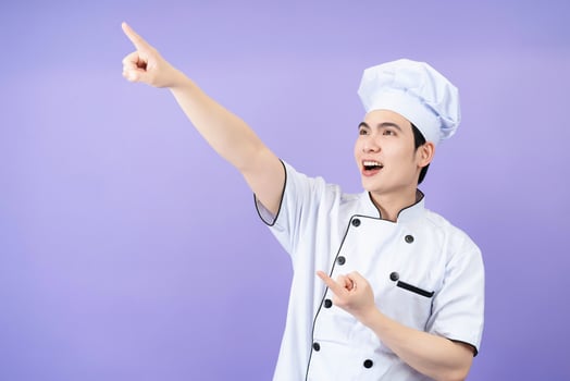 Young Asian male chef on background photo