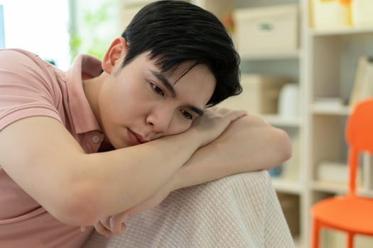 Photo of young Asian man at home
