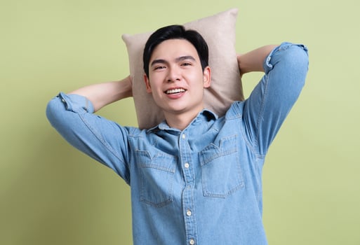 Photo of young Asian man on green background