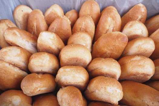 fresh baked breads in a box at a bakery shop photo
