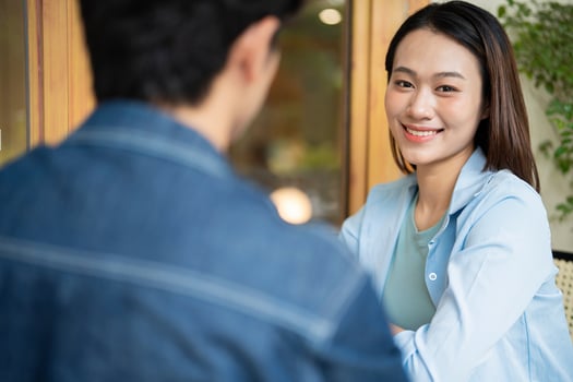 Photo of young Asian couple hang out together