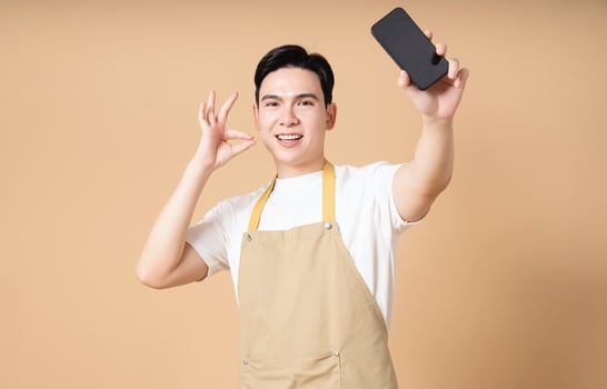 Photo of young Asian man on background