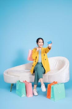 Photo of young Asian businesswoman on background