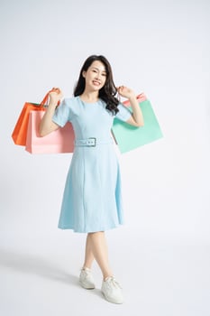 Photo of young Asian woman on background