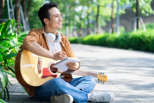 Portrait of young Asian man outside photo