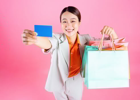 Photo of young Asian businesswoman on background