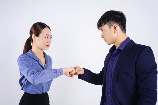 Photo of two young Asian business people on white background