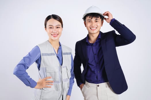 Photo of two young Asian business people on white background