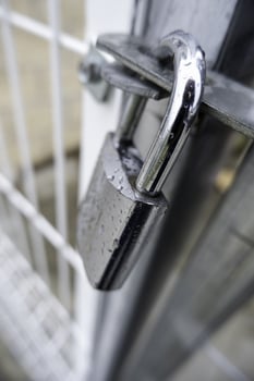 Metal door with padlock photo
