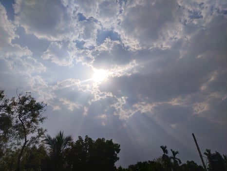 The light from the sun shining through the clouds. photo