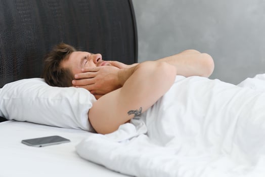 Young man in bed , trying to sleep photo