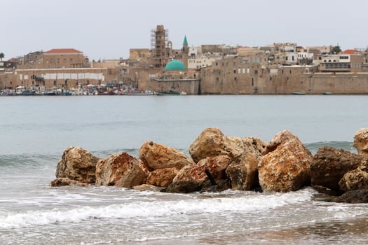 Stones and shells on the shore of the Mediterranean Sea. photo