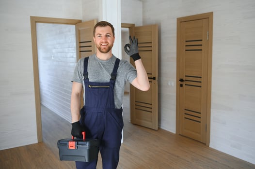Process of construction new and modern modular house from composite sip panels. Worker man in special protective uniform wear working on building development industry of energy efficient property. photo