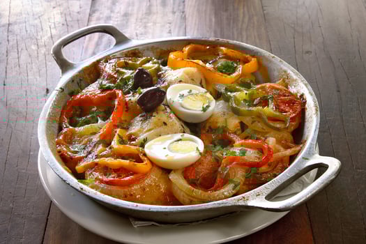 Wood-fired cod with eggs and peppers photo