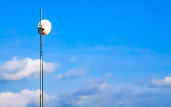 Red white 5G tower radiation in Puerto Escondido Mexico. photo