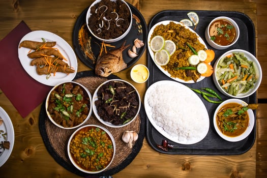 Assorted indian food Loitta Fry Fish, Fried Pomfret, Jhura Bhuna, Indian Shredded Beef, kala bhuna, mezbani Gosht, dala chana, yakhni biryani, plain rice, chicken rezala, stir fry Mix Vegetables, photo