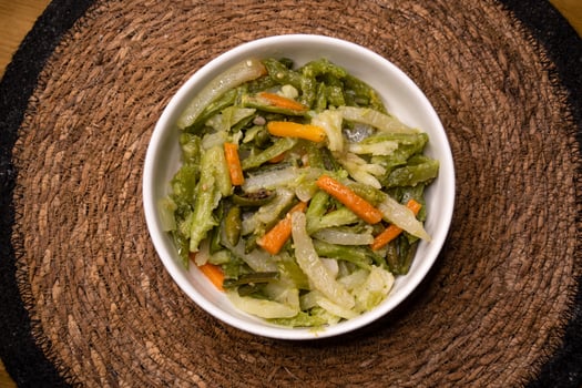 stir fry Mix Vegetables with carrot, capsicum and radish served in dish isolated on wooden background top view indian spices, bangladeshi and pakistani food photo