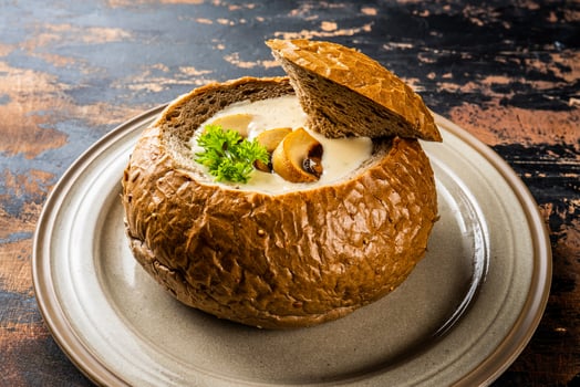 mushroom cream soup served in bread bowl isolated on background top view of arabic food photo