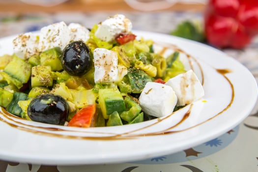 Greek Salad with cheese, cucumber, tomato and olives served in dish isolated on table top view of arabic food photo