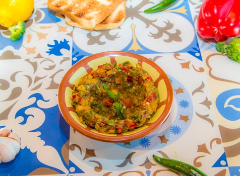 Baba Ganoush, Ghanoush, ghanouj or ghanouj with tomato and pomegranate seeds served in dish isolated on table top view of arabic food photo