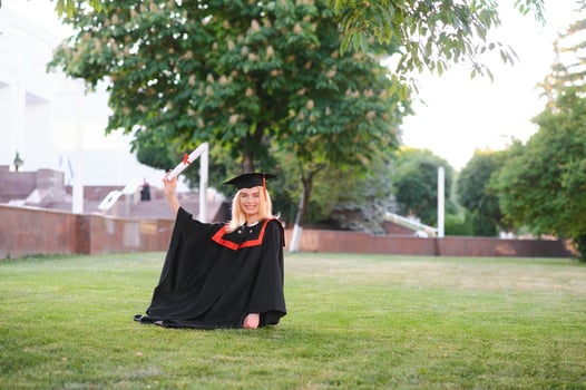 Portrait of a happy woman on her graduation day at university. Education and people. photo