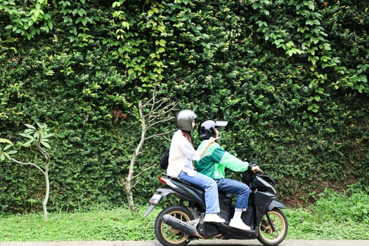 Female Passenger Showing Direction to Ojek Online photo