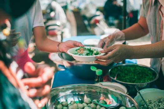 Hungry homeless people request free food donations from volunteers social concept of helping photo