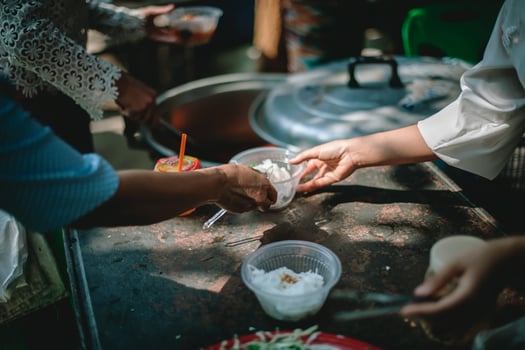 Sharing warm food for homeless and homeless people photo