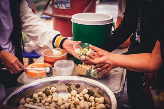 Sharing warm food for homeless and homeless people photo