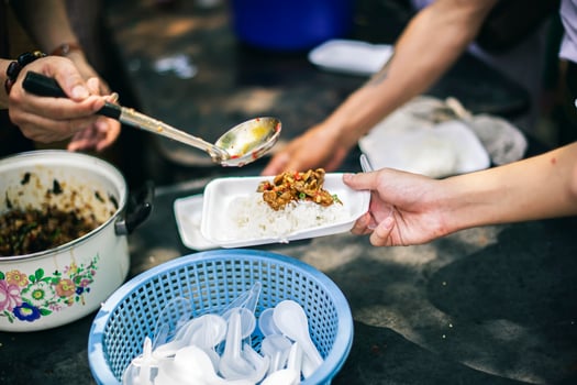 Volunteer concept to donate ready-to-eat food to the hungry and poor photo