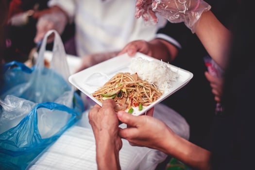 From hand to hand. Sharing Food With Homeless photo