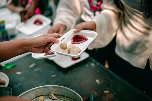 From hand to hand. Sharing Food With Homeless photo