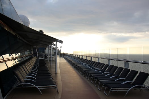 On the upper deck of a large ocean liner. photo