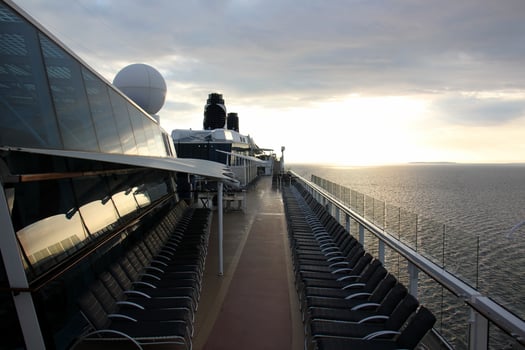 On the upper deck of a large ocean liner. photo