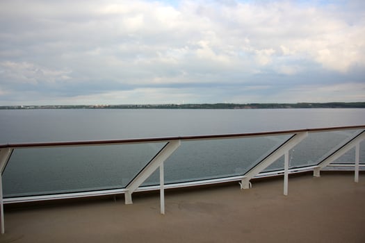 On the upper deck of a large ocean liner. photo