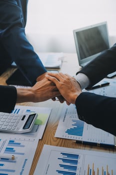 Business people join hands to join forces as a teamwork. photo