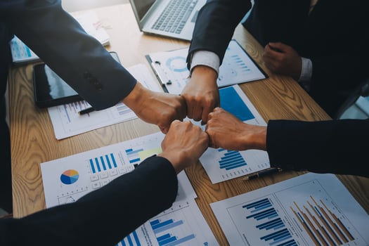 Business people join hands to join forces as a teamwork. photo