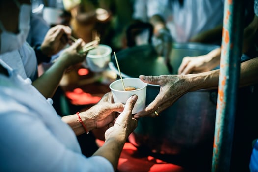 hands of the poor receive food from the donor's share. poverty concept photo
