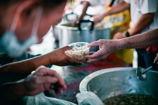 The hands of poor have been aided by charity food to alleviate hunger photo