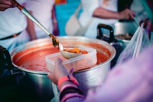 Poor people receive donated food from donors photo