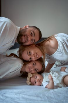 all family together poses for a photo
