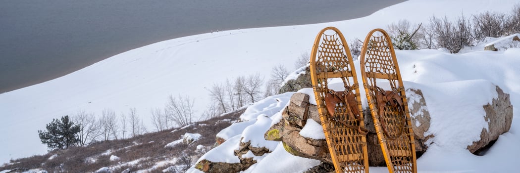 mountain lake and classic snowshoes photo