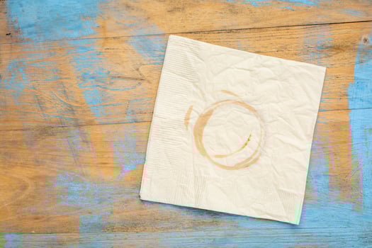 napkin with coffee stains on wood photo