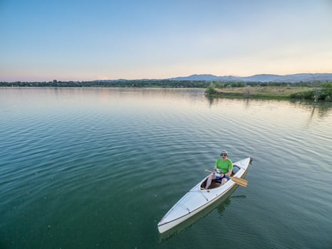 operating drone from canoe photo
