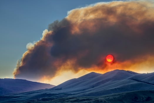 sunset obscured by wildfire smoke photo