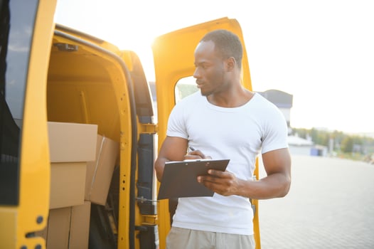 Logistics, delivery car and man with clipboard paperwork or checklist for stock, product distribution or shipping info photo